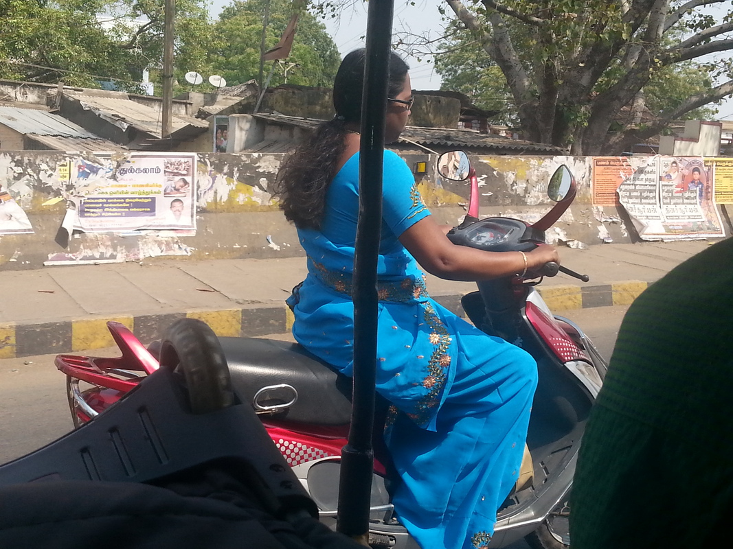 Indian lady on moped