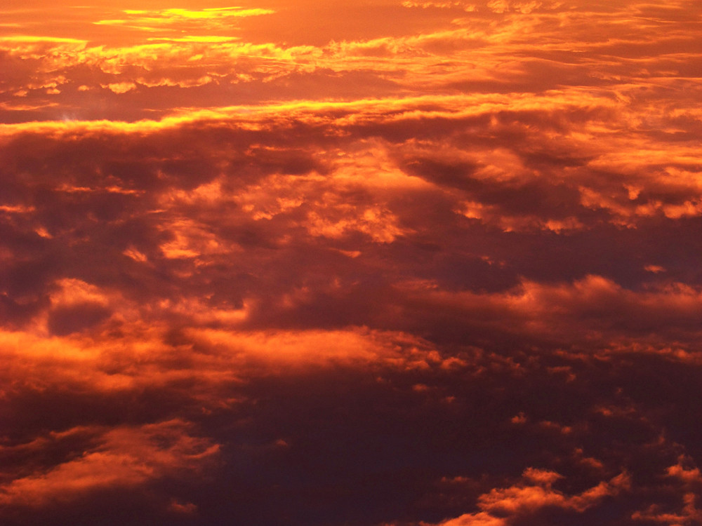 Sonnenuntergang über den Wolken